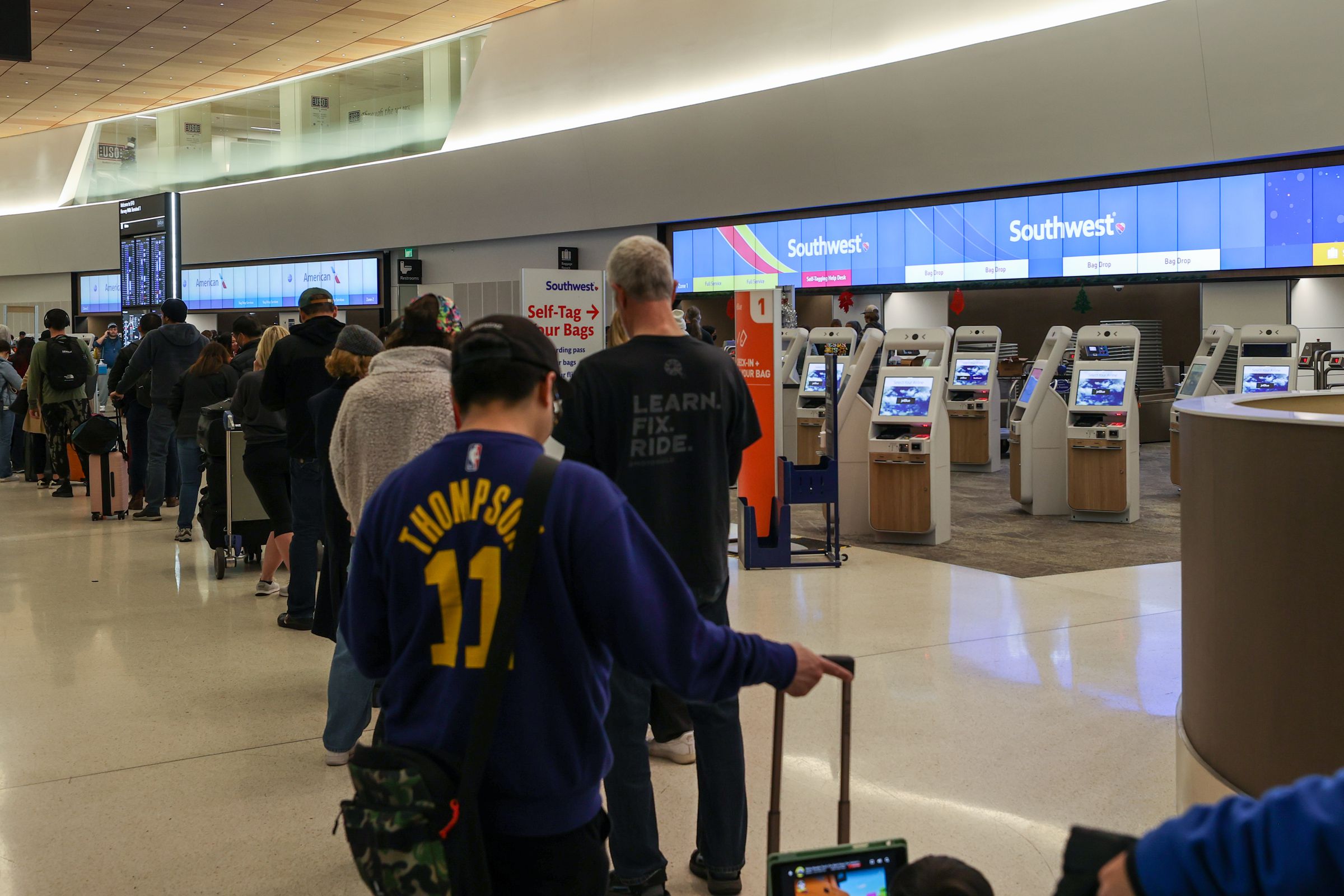 People waiting at the Southwest Airlines counter at San Francisco International Airport