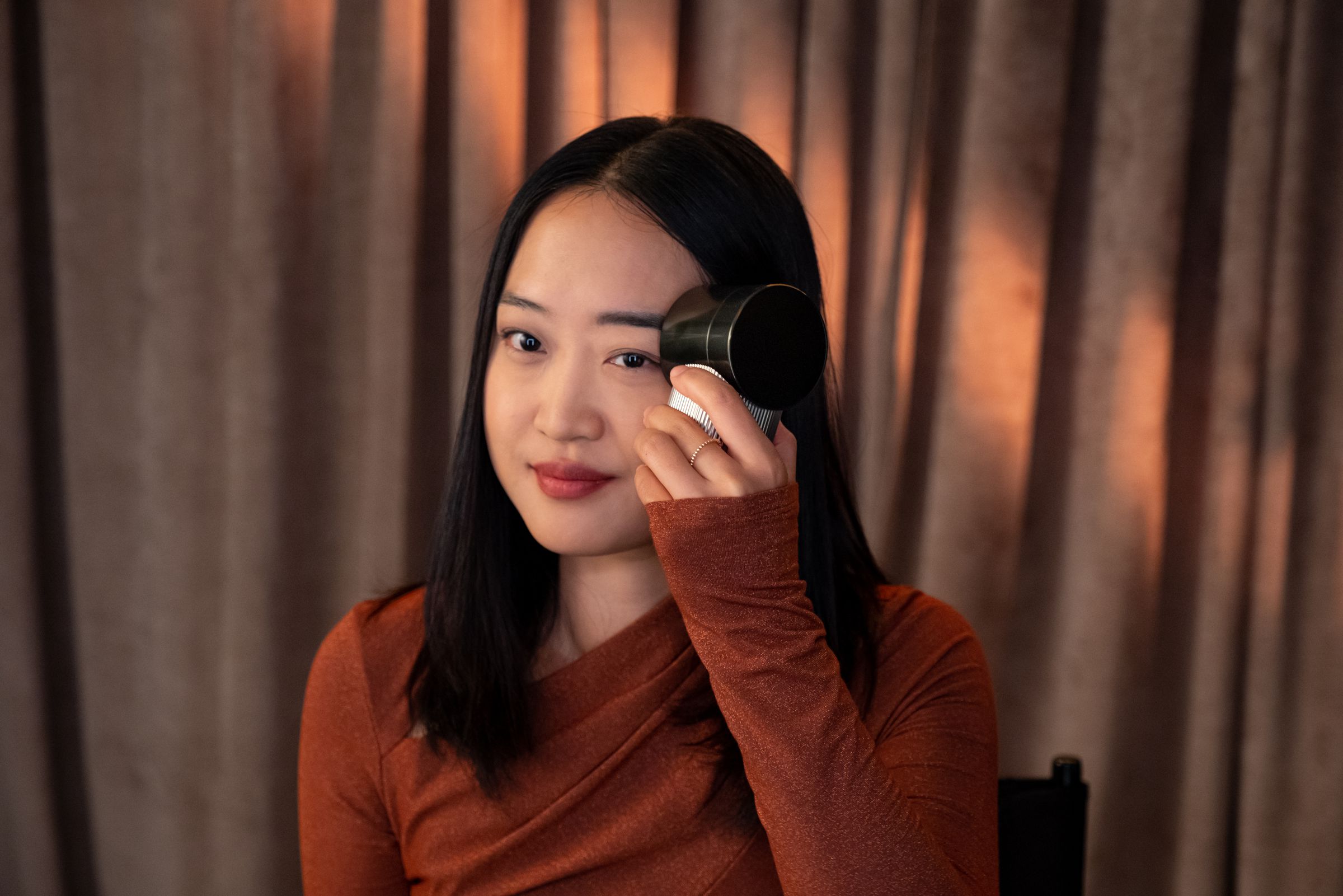 woman using Brow Magic device